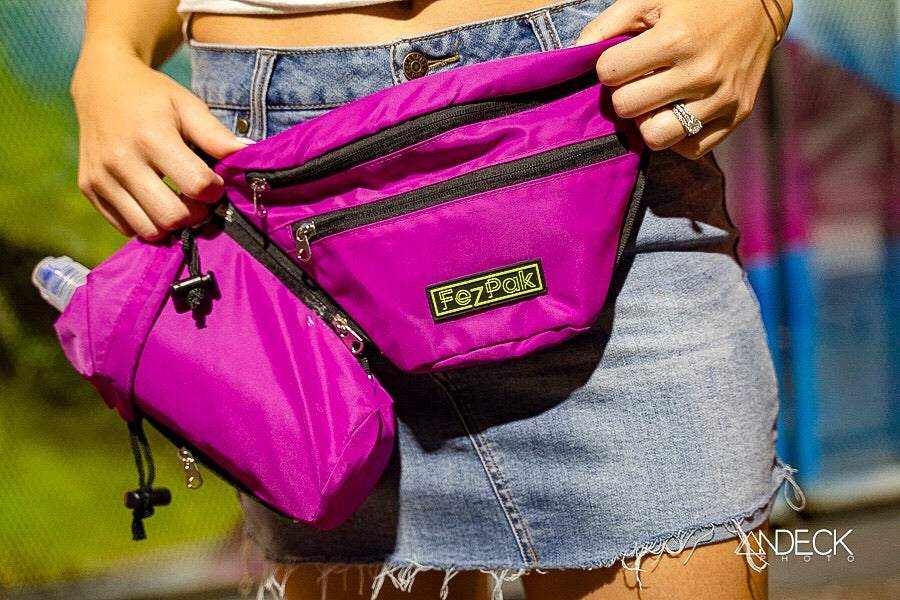 Purple FezPak customizable flat fanny pack with detachable bottle holder worn with denim skirt