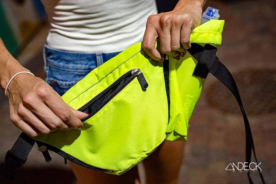 FezPak customizable fanny pack in neon yellow with water bottle holder and zip pocket.